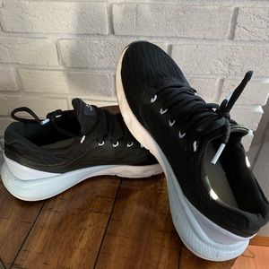 Women’s under Armour black/powder blue tennis shoes. Size 9